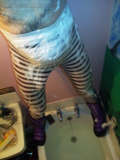Opening my legs and having a piss in my soapy and wet hooped tights while wearing my chunky goth boots; I am getting a HUGE hard-on before cumming loads!